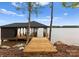 Wooden dock with covered boat slip and expansive views of the lake at 8066 Edgewater Dr # 103, Norwood, NC 28128
