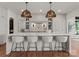 A spacious kitchen with a marble island and white cabinets, perfect for entertaining at 8066 Edgewater Dr # 103, Norwood, NC 28128