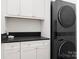 A modern laundry area features sleek appliances, ample storage, and stylish finishes for efficiency at 8066 Edgewater Dr # 103, Norwood, NC 28128