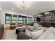 Open-concept living room showcases stylish furniture, water views, and a wet bar for seamless entertaining at 8066 Edgewater Dr # 103, Norwood, NC 28128