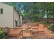 Spacious wooden deck featuring multiple levels and views of the landscaped backyard at 8117 Rising Meadow Rd, Charlotte, NC 28277