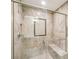 Luxurious marble shower featuring a built in seat, shower head, and glass door at 8117 Rising Meadow Rd, Charlotte, NC 28277