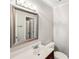 Bright bathroom features a vanity with a large mirror and a modern light fixture at 8117 Rising Meadow Rd, Charlotte, NC 28277