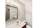 Bright bathroom featuring a vanity with a large mirror with modern fixtures and white toilet at 8117 Rising Meadow Rd, Charlotte, NC 28277