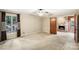 Spacious bedroom with a ceiling fan, carpet floors, and stone fireplace in the next room at 8117 Rising Meadow Rd, Charlotte, NC 28277