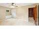 Neutral bedroom with a ceiling fan and closet for optimal storage and a built in bench seat under the window at 8117 Rising Meadow Rd, Charlotte, NC 28277
