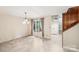 Open dining room featuring marble floors, large windows, and a chandelier at 8117 Rising Meadow Rd, Charlotte, NC 28277