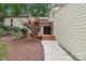 Front entrance of a home with a walkway leading to a covered porch with a beautiful double door at 8117 Rising Meadow Rd, Charlotte, NC 28277
