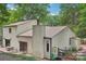 Exterior angle of a home with neutral siding and a chimney, showcasing its backyard patio at 8117 Rising Meadow Rd, Charlotte, NC 28277