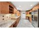 Spacious kitchen featuring stainless steel appliances, wood cabinets, and granite countertops at 8117 Rising Meadow Rd, Charlotte, NC 28277