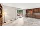 Living room featuring sliding doors leading to a wooden deck and built-in wooden shelving at 8117 Rising Meadow Rd, Charlotte, NC 28277
