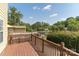Beautiful backyard deck overlooking a tranquil pond, perfect for relaxing and enjoying nature at 9006 Four Mile Creek Rd, Charlotte, NC 28277