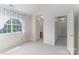 Bright bedroom with carpeted floors and a view to the bathroom and hallway at 9006 Four Mile Creek Rd, Charlotte, NC 28277