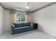Bedroom with carpeted floor, couch, and window with bright light at 9006 Four Mile Creek Rd, Charlotte, NC 28277