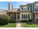 Charming townhouse featuring a brick and siding facade with a well-manicured lawn and inviting entrance at 9006 Four Mile Creek Rd, Charlotte, NC 28277