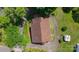An aerial view of a home showing the brown roof, surrounding greenery, and circular driveway at 102 Lake Dr, Hickory, NC 28601