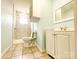 Bright bathroom with a toilet, vanity, and shower with marble tile and glass doors at 102 Lake Dr, Hickory, NC 28601
