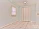 Bright bedroom with light-blue walls, neutral floors, and a closet with bi-fold doors at 102 Lake Dr, Hickory, NC 28601