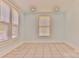 Bright room featuring tile flooring, light blue walls, and two windows at 102 Lake Dr, Hickory, NC 28601