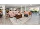 Basement living area includes a couch, seating, and lots of natural light at 1041 Brawley School Rd, Mooresville, NC 28117