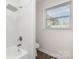 Tiled bathroom with shower/tub combination and large shower head at 1041 Brawley School Rd, Mooresville, NC 28117