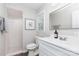 Bright bathroom featuring a tiled walk-in shower and modern vanity at 1041 Brawley School Rd, Mooresville, NC 28117