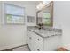 Bathroom with granite countertop and window providing natural light at 1041 Brawley School Rd, Mooresville, NC 28117