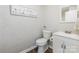 Clean half-bath features white textured walls and modern fixtures at 1041 Brawley School Rd, Mooresville, NC 28117