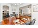 Elegant dining room with hardwood table set, chandelier, and seamless living area access at 1041 Brawley School Rd, Mooresville, NC 28117