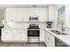 Updated kitchen featuring white cabinets, stainless steel appliances, and hardwood flooring at 1041 Brawley School Rd, Mooresville, NC 28117