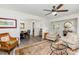 Inviting living room features hardwood floors, ceiling fan, and an adjacent dining area at 1041 Brawley School Rd, Mooresville, NC 28117