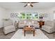 Inviting living room featuring stylish seating, natural light, and hardwood flooring at 1041 Brawley School Rd, Mooresville, NC 28117