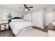 Comfortable bedroom features hardwood floors, ample natural light, and ceiling fan at 1041 Brawley School Rd, Mooresville, NC 28117