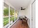 Screened porch features seating and views of lush landscape at 1041 Brawley School Rd, Mooresville, NC 28117