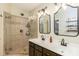 Bathroom showcases a glass enclosed tiled shower and double sink vanity at 10419 Chelsea Bay Dr, Charlotte, NC 28278