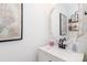 Stylish powder room features modern fixtures, decorative mirror, and a fresh, updated aesthetic at 10419 Chelsea Bay Dr, Charlotte, NC 28278