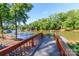 Dock view showcases tranquil lake access, perfect for boating and enjoying the serene waterfront lifestyle at 10419 Chelsea Bay Dr, Charlotte, NC 28278