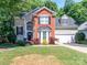 Beautiful two-story home with a well-manicured lawn and a welcoming entrance at 10419 Chelsea Bay Dr, Charlotte, NC 28278