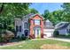 Lovely two-story home featuring brick accents, a garage, and lush, mature landscaping at 10419 Chelsea Bay Dr, Charlotte, NC 28278