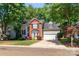 Charming two-story home with brick and siding exterior and attached two car garage at 10419 Chelsea Bay Dr, Charlotte, NC 28278