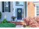 Welcoming front entrance with a wreath on the door and colorful landscaping at 10419 Chelsea Bay Dr, Charlotte, NC 28278