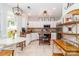 Bright kitchen features white cabinets, granite counters, stainless appliances, and a cozy breakfast nook at 10419 Chelsea Bay Dr, Charlotte, NC 28278