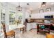 Sunlit kitchen boasts stainless appliances, granite countertops, and white cabinets with a window view at 10419 Chelsea Bay Dr, Charlotte, NC 28278