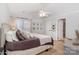 Serene main bedroom offers a calming retreat with soft lighting, plush bedding, and ample closet space at 10419 Chelsea Bay Dr, Charlotte, NC 28278