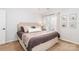 Cozy main bedroom offers natural light, neutral decor, and comfortable space at 10419 Chelsea Bay Dr, Charlotte, NC 28278