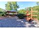 Outdoor pavilion with picnic tables and a kayak rack, perfect for community gatherings and waterfront recreation at 10419 Chelsea Bay Dr, Charlotte, NC 28278