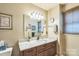 Updated bathroom with marble countertop, wood cabinets, and modern fixtures at 105 Carmel Hills Dr, Gastonia, NC 28056