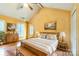 Bright bedroom boasts high ceilings, ceiling fan, natural light, and stylish decor for a welcoming retreat at 105 Carmel Hills Dr, Gastonia, NC 28056