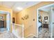 Hallway with staircase leading to bedrooms; view of the primary bedroom at 105 Carmel Hills Dr, Gastonia, NC 28056