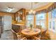 Charming eat-in kitchen featuring a round wooden table with seating for four and natural light at 105 Carmel Hills Dr, Gastonia, NC 28056